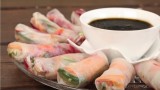 Rice shelves blintzes with fresh vegetables and Asian sauce